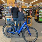 Travis Greentree and Josie Smith, owners of Decorah Bicycles, pose with the latest model of Trek Verve +3. Photo by Wanda Hanson