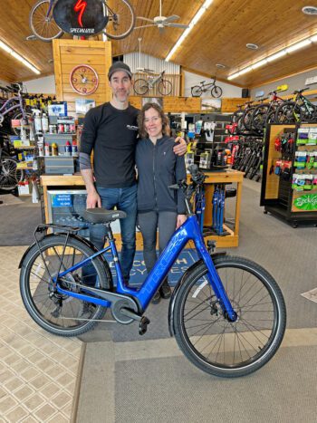 Travis Greentree and Josie Smith, owners of Decorah Bicycles, pose with the latest model of Trek Verve +3. Photo by Wanda Hanson