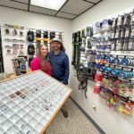 Angela and Josh with some of the merchandise they offer in their shop, Money Creek Outfitters in Houston, Minn. Photo by Wanda Hanson