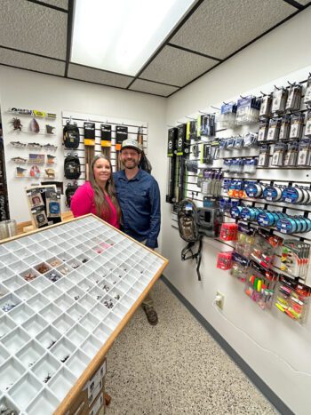 Angela and Josh with some of the merchandise they offer in their shop, Money Creek Outfitters in Houston, Minn. Photo by Wanda Hanson