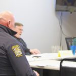 Rushford Police Chief Adam Eide, center, discusses body worn cameras at the March 24 council meeting. Also, pictured, form left, are City Administrator Tony Chladek and Councilors Jim O’Donnell and Sally Ryman. Photo Kirsten Zoellner