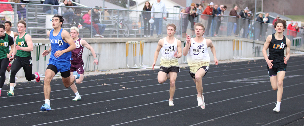 RPH’s Caden Mattson (far left), Chatfield’s Alden Pearson (partially occluded), Caledonia/Spring Grove’s Owen (left) and Eli (right) Staggemeyer, and LFCMC’s Adrian Rindels compete in the final heat of the boys 100-meters at the RPH Meet. Cotter’s Ezra Burros took first with Eli, Caden, Owen, Adrian, and Logan finishing two thru six. Photo by Paul Trende