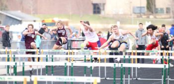 Chatfield’s Ross Stoehr and Keegan Patten (far left) and Caledonia/Spring Grove’s Ethan Stendel (second from right) compete with a pair of athletes from La Crosse-Logan in the 110-meter hurdles at the RPH Meet. Stendel won the above race and the High Jump at the event. Photo by Paul Trende