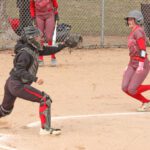 GMLOK catcher Cheyenne Bakken awaits the throw as Houston’s Julia Swenson approaches home plate. The Bulldogs built a 10-4 lead and held off a two-out, seventh-inning Hurricane charge, as GMLOK prevailed 10-9. Photo by Paul Trende