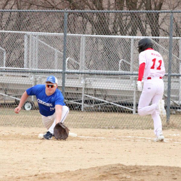 …over on the baseball diamond, Houston’s C.J. Wruck is narrowly thrown out at first with Cougar Milton Hutchinson collecting the nice assist, though the Hurricanes got a shut-out from pitchers Morgan Rohweder and Hector Steinfeldt in a 3-0 ‘Cane win. Photo by Paul Trende