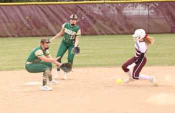 Chatfield’s Madyson Proper will get the stolen base ahead of the tag by Rushford-Peterson’s Torryn Schneider while Brielle Schneider backs up the play. The Gophers rolled to 6-0 on the year courtesy of an 8-1 win over the Trojans. Photo by Paul Trende