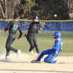 Fillmore Central/Lanesboro’s Joey Pederson fields the ball back of second base, does not get the force at the bag on Mabel-Canton’s Kale Eiken, but does get the out at first. Pederson also got the pitching win as the Falcons topped the Cougars 5-2. Photo by Paul Trende