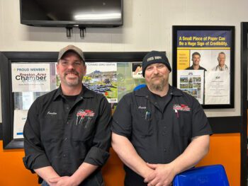 Justin Jones, left, and Craig Bond of Preston Service Plus organize and run Show and Shine, the Trout Days Car Show. Photo by Wanda Hanson