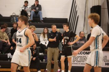 Kingsland senior Gavin Hubka listens to instruction from his father and coach, Jim Hubka, during a home game. Despite his open heart surgery after being diagnosed with Marfan syndrome, Gavin played through the final season with strength and determination. Photo submitted