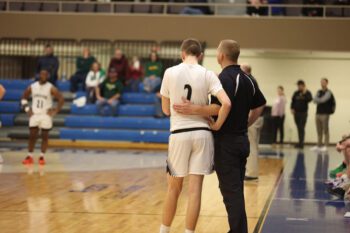 Coach Jim Hubka and his son Gavin stand shoulder to shoulder during a break in the game. As player and coach – and father and son – their final season together became a testament to resilience and family. Photo submitted