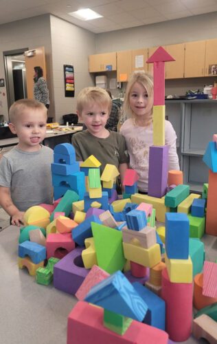 Preschoolers building with foam blocks. Photo submitted