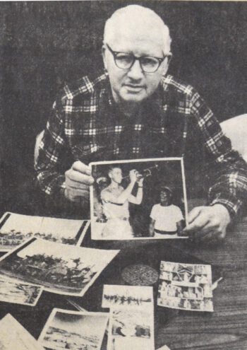 Stan Muenkel displays photos and newspaper clippings of the years when he played trumpet with U. S. Navy bands and with Ringling Bros. and Barnum & Bailey circus band. Photo by Merle Dalen, courtesy of the Post Bulletin and the Houston County Historical Society