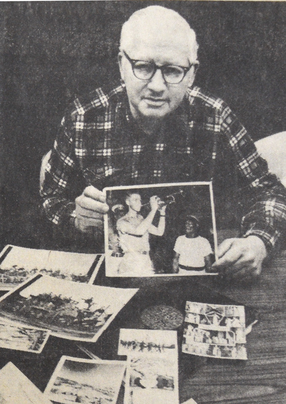 Stan Muenkel displays photos and newspaper clippings of the years when he played trumpet with U. S. Navy bands and with Ringling Bros. and Barnum & Bailey circus band. Photo by Merle Dalen, courtesy of the Post Bulletin and the Houston County Historical Society