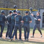 Fillmore Central/Lanesboro’s Levi Rogers approaches home plate and his teammates after hitting a two-run home run versus PEM. The Falcons beat both D-E (13-3 in five innings) and PEM (9-4) to end a year-plus long TRC losing streak, and to improve to 3-3 on the year. Photo by Deb Finseth