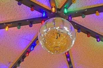 The disco ball is still hanging from the ceiling in the former Harmony Roller Skating Rink, now the new Stardust Retro Revival antique mall. Photo by Charlene Corson Selbee