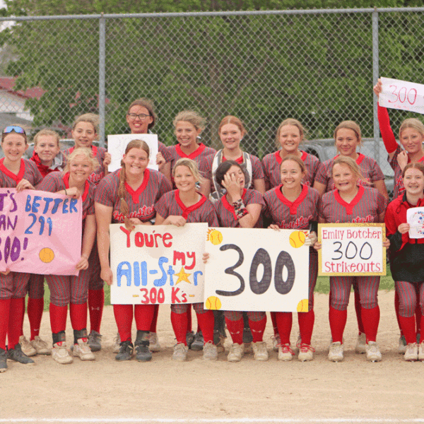 Houston softball poses with teammate Emily Botcher (front row, fourth from left), who amassed her 300th career strikeout in an 8-0 win over Spring Grove (where the senior was a late hit away from a no-hitter). With the win, the Hurricanes also claimed a share of the SEC title with Southland. Photo by Paul Trende