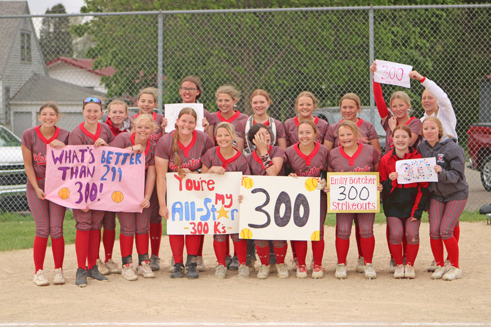 Houston softball poses with teammate Emily Botcher (front row, fourth from left), who amassed her 300th career strikeout in an 8-0 win over Spring Grove (where the senior was a late hit away from a no-hitter). With the win, the Hurricanes also claimed a share of the SEC title with Southland. Photo by Paul Trende