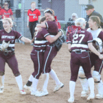 Chatfield’s Katryn Johnson and Rylee Urban (center) hug it out while teammates Grace Finley (#12), Brynn Horsman (#27), and Makenna Dornack are also overjoyed after the Gophers came back from down 4-0 to beat Cannon Falls 5-4, securing them a spot against Randolph in the 1AA final four “no-loss” game. Photo by Paul Trende