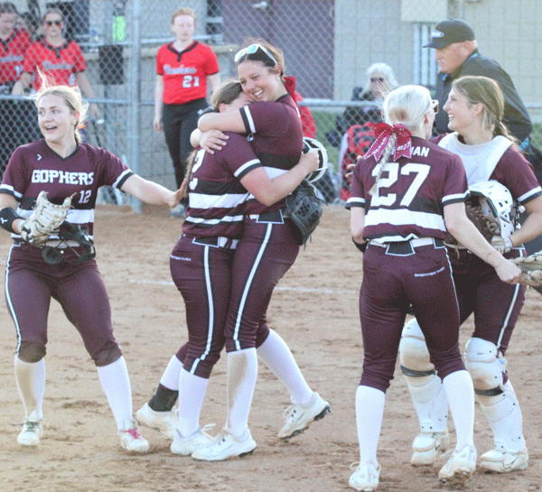Chatfield’s Katryn Johnson and Rylee Urban (center) hug it out while teammates Grace Finley (#12), Brynn Horsman (#27), and Makenna Dornack are also overjoyed after the Gophers came back from down 4-0 to beat Cannon Falls 5-4, securing them a spot against Randolph in the 1AA final four “no-loss” game. Photo by Paul Trende