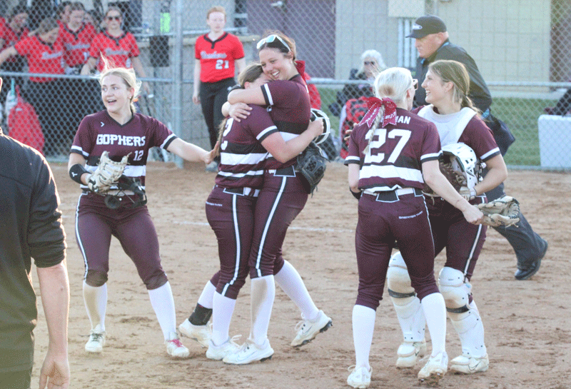 Chatfield’s Katryn Johnson and Rylee Urban (center) hug it out while teammates Grace Finley (#12), Brynn Horsman (#27), and Makenna Dornack are also overjoyed after the Gophers came back from down 4-0 to beat Cannon Falls 5-4, securing them a spot against Randolph in the 1AA final four “no-loss” game. Photo by Paul Trende