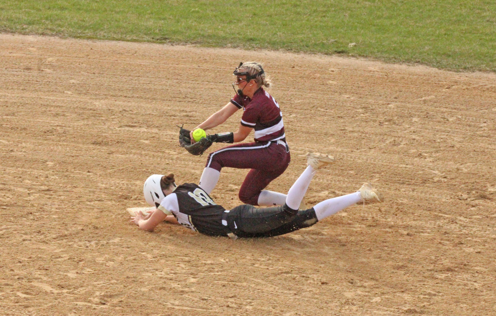 Caledonia’s Paizley Lange slides into second base ahead of the force by Chatfield’s Brittin Ruskell, a hustle play that allowed a bases loaded run to score. Caledonia, #5 in AA, topped the Gophers, #9 in AA, by 4-0 final in a key TRC matchup of East and West TRC division leaders. Photo by Paul Trende