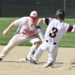 Ezra Konkel steals second base while defended by Houston second baseman Coltin Groth. The Spring Grove freshman (wearing #3) batted 3 for 3, stole three bases, scored three runs and drove in another during the Lions’ runaway 18-8 road win.” Photo by Lee Epps