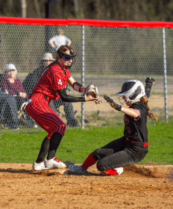 GMLOK’s Mollie Voigt makes third base ahead of the tag of Houston’s Olivia Yohe in the team’s SEC game, an 8-5 Bulldog win where they swept the season series. Photo by Emma Geiwitz