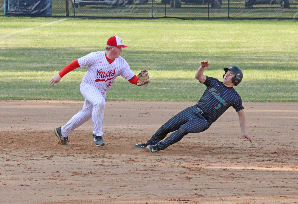 After a botched bunt, Fillmore Central/Lanesboro’s Carter O’Connor finds himself in a pickle with Houston third baseman Coltin Groth. O’Connor was tagged out, but the Falcons came back to beat the Hurricanes 5-3 for FC/L’s fourth straight win. Photo by Paul Trende