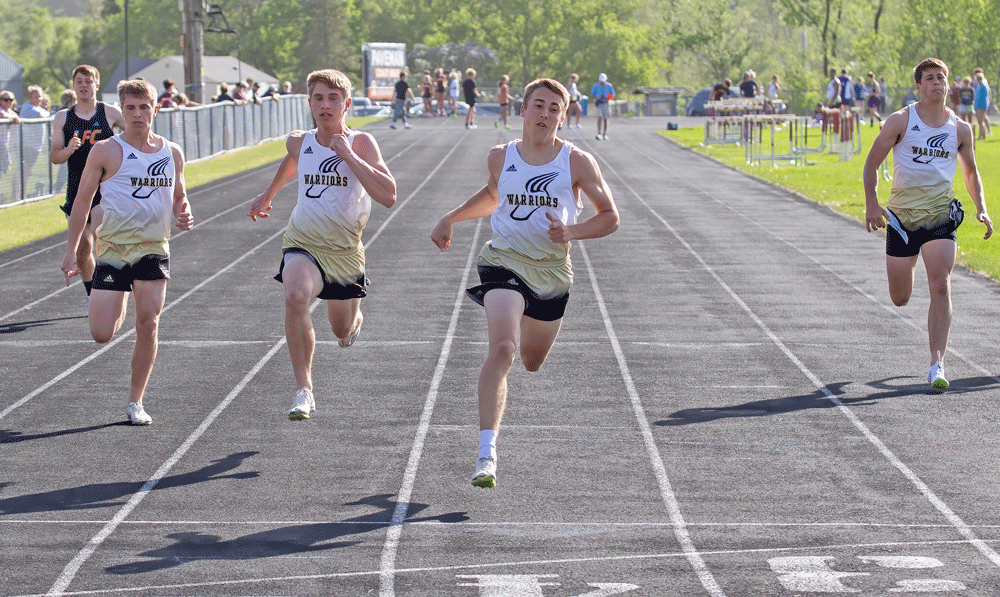 Caledonia/Spring Grove’s Owen Staggemeyer (third place), Eli Staggemeyer (second place), Fischer Wait (first), and Coby Hammell (fifth) all near the finish line of the 100-meters at the Chatfield Invite. Gopher Logan Pearson (fourth) completed the top five. Photo by Leif Erickson