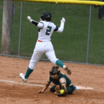 FC/L’s Braelyn Hovey makes it through the bag at first as R-P’s Lindsey Hoiness stretches to make the out. The Trojans swept the teams’ doubleheader, including twice being dead to lose in game two, down 14-4 in the sixth and 14-7 in the seventh (both with two outs), but winning 15-14 in eight innings. Photo by Deb Finseth