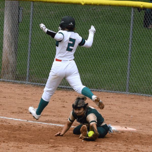 FC/L’s Braelyn Hovey makes it through the bag at first as R-P’s Lindsey Hoiness stretches to make the out. The Trojans swept the teams’ doubleheader, including twice being dead to lose in game two, down 14-4 in the sixth and 14-7 in the seventh (both with two outs), but winning 15-14 in eight innings. Photo by Deb Finseth