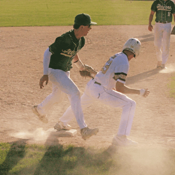 After an infield hit, Rushford-Peterson’s Cayden Lea tries to catch Caledonia’s Jack Schmitz leaning off third base (to no avail). The play was part of a seven-run sixth that led to a 13-3 Caledonia win, as the Warriors (14-6) posted their second straight 4-1 week. Photo by Paul Trende