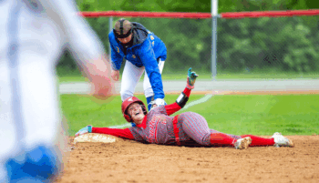 Aspen Peterson’s mood on third base epitomizes all the Houston Hurricanes; very happy. Team double-H beat Schaeffer Academy 25-4, Hayfield 16-6 (above), and then Wabasha-Kellogg 13-3, all by the mercy rule, to book their first trip to Austin and a section final four since 2013. Photo by Emma Geiwitz