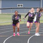 GMLOKS’ Avery Stroup readies to hand the baton to Chantle Reiland for the last leg of the girls 4x100 at the Bulldogs’ home meet. Said team took first, and the GMLOKS girls won their fourth team title of the year. Photo by Paul Trende