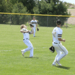 Caledonia second baseman Tanner Ginther goes into foul territory to make a nice play on the ball as teammates Garrett Konz (near) and Mason King (far) are also pictured. Defense and pitching earned Caledonia play-offs wins in their first two games, 4-0 over Lake City, and 8-0 over Randolph. Photo by Paul Trende