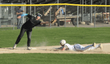 Caledonia’s Garrett Konz slides safely into third with a stolen base, as Fillmore Central/Lanesboro’s Jarek Schultz cannot field the throw. The Warriors (10-5) beat the Falcons 8-2 for their fourth straight win. Photo by Paul Trende