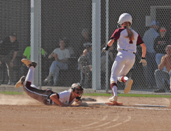 Chatfield’s Brittin Ruskell dives into first base to try to make the out in the Gophers’ key match-up with Dover-Eyota. The Eagles posted a 13-11 win, as they (10-2, 13-4) now lead the TRC-West over Chatfield (10-3, 14-3). Photo by Leif Erickson