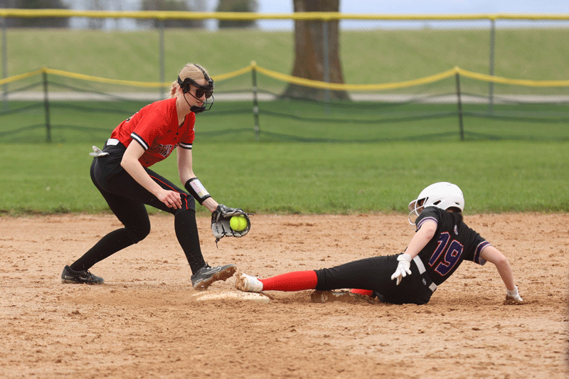 GMLOK’s Paisley Schlee makes second base safely in front of Spring Grove’s Joelle Halverson in the Bulldogs’ 12-2 SEC win. Photo by Christine Vreeman