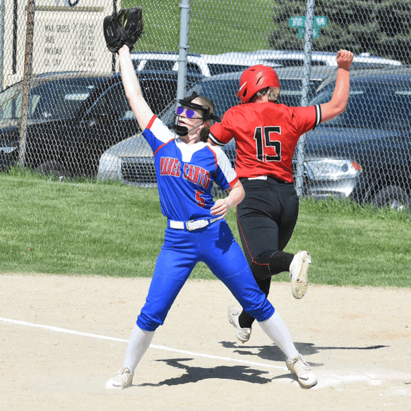Mabel-Canton’s Lydia Vatland catches the late throw as Spring Grove’s Sydney Holland is safe at first base on an infield error. Holland was one of only two Lion batters to reach base during a 15-0 Mabel-Canton win in four innings. Photo by Lee Epps