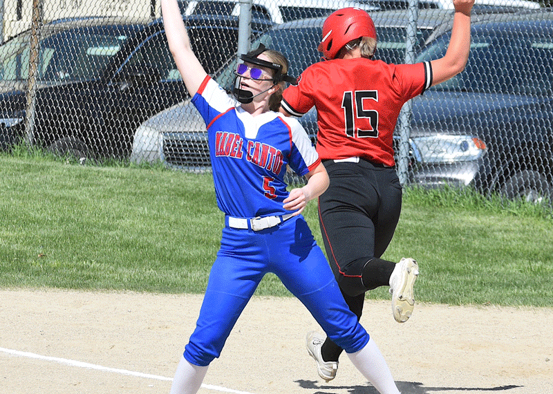 Mabel-Canton’s Lydia Vatland catches the late throw as Spring Grove’s Sydney Holland is safe at first base on an infield error. Holland was one of only two Lion batters to reach base during a 15-0 Mabel-Canton win in four innings. Photo by Lee Epps