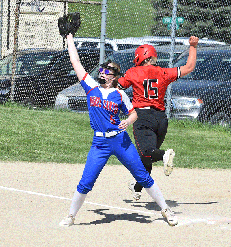 Mabel-Canton’s Lydia Vatland catches the late throw as Spring Grove’s Sydney Holland is safe at first base on an infield error. Holland was one of only two Lion batters to reach base during a 15-0 Mabel-Canton win in four innings. Photo by Lee Epps
