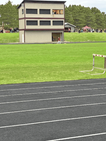 The new press box dwarfs the old one that is being dismantled. Photo by Mary Allen