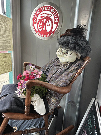 Granny Irene greets potential customers from her rocker in the store window.