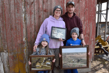 Kristi and Kevin Schuldt and their two young children, Emma and Henry, are continuing the Schuldt family farming tradition. Photo by Charlene Corson Selbee