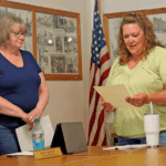 Missy Musel, right, reads the oath of office after being appointed to the Wykoff City Council during the May 12 meeting. City Administrator Becky Schmidt, left, officiated the swearing-in. Photo by Zech Sindt