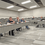 The Rushford-Peterson School Board considers the recommendation the Steering Committee for a potential building project. From left to right: Matt Helgemoe, Jeff Michel, Carl Schollmeier, Ken Sawle, Nancy Snyder, HR/Payroll Clerk Megan Boyum, Superintendent Ben Bernard, Chair Amy Woxland and Chris Grindland. Photo by Wanda Hanson