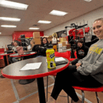 Surrounded by furniture and instruments from the school’s band room, the school prepares for a summer of construction at the school. Pictured from left to right: Board Chair Stephanie Jaster, Member Lisa Myhre, Incoming Member Ashley Olson, Student Council Representative Sylas Flatin, and Member Kelly Rohland. Photo by Charlene Corson Selbee