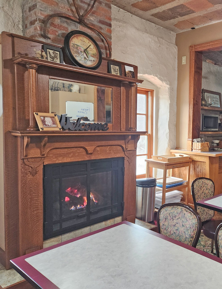 The breakfast area at Stone Mill Hotel & Suites comes complete with a fireplace to enjoy while dining. Photo by Barb Jeffers