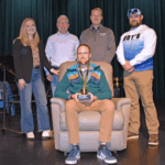 Fillmore County Journal Teacher of the Year Dan Winkler, surrounded by Katelyn Redalen of Drury’s Furniture, Jason Sethre of the Fillmore County Journal, Brad Hoiness of Rushford/Preston/Harmony Foods, and Cody Koebke of Ody’s Country Meats and Catering. Photo by Barb Jeffers