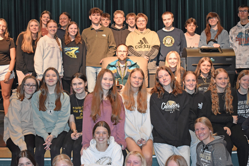 Dan Winkler and some of his students at Caledonia High School celebrate him being named Fillmore County Journal Teacher of the Year. Photo by Barb Jeffers